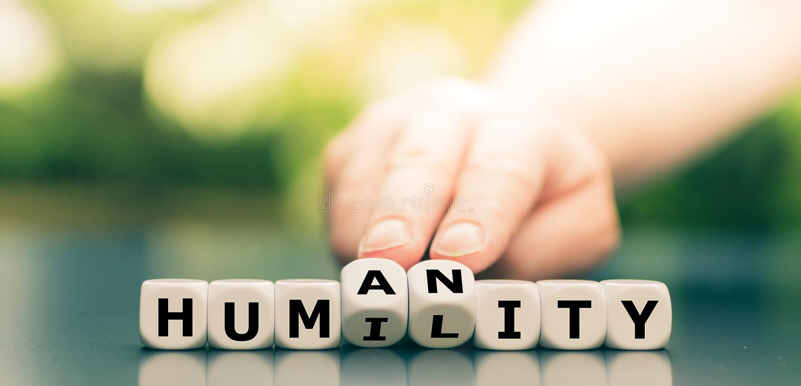 Dice form the words `humility` and `humanity`. Dice form the words `humility` and `humanity royalty free stock images